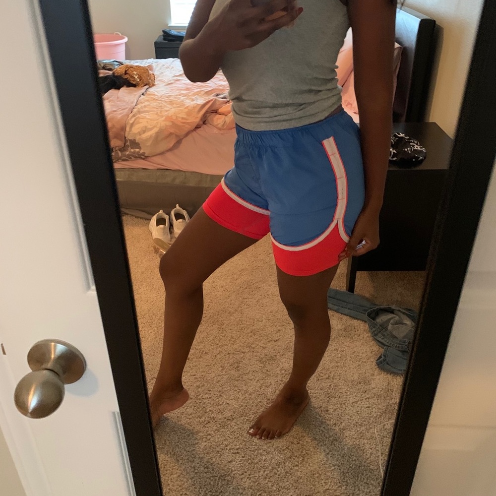 Blue and neon pink running shorts